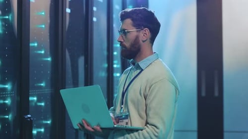 A Highly Skilled Professional Specializing in Data Center Analysis Using a Laptop Effectively