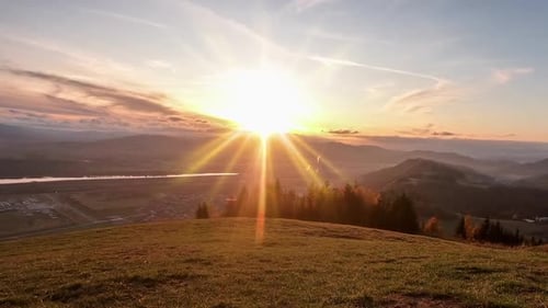 Majestic Sunset over Mountainous Valley Landscape