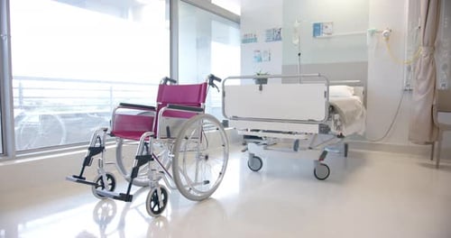 Close up of wheelchair in sunny hospital room, slow motion