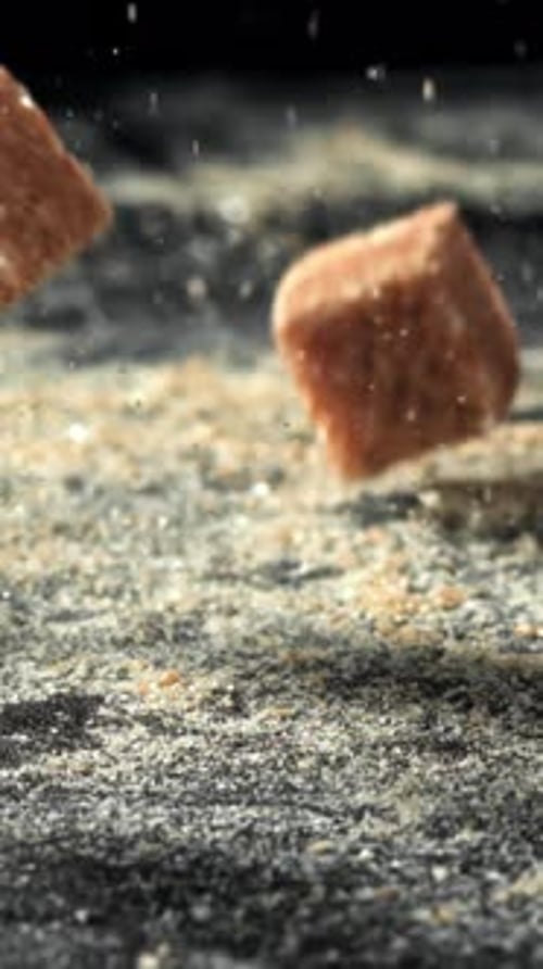 Cane Sugar Cubes Fall on the Table Filmed on a Highspeed Camera at 1000 Fps