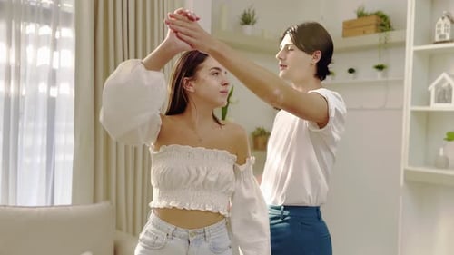 Young Couple Dancing Together at Home