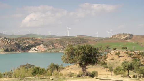 Lake Landscape And Wind Turbines On Hill, Spain