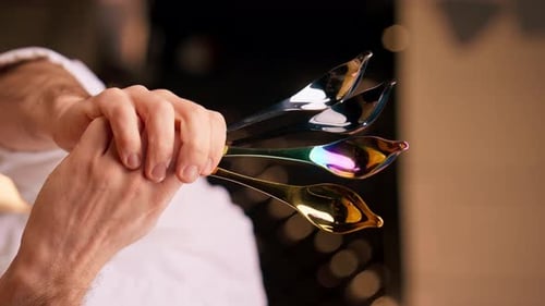 Shimmering Iridescent Rainbow Light Reflected on Spoons