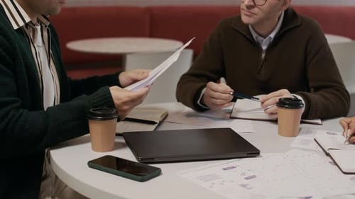 Teamwork at Round Table for Corporate Brainstorming Session