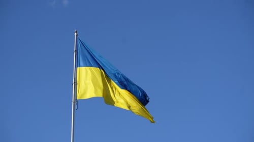 Ukraine Flag Waving against Blue Sky
