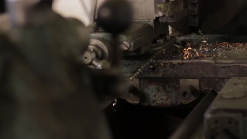 shop on the countryside using a lathe and measuring the dimensions.