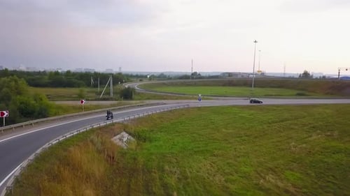 Aerial Drone Following Biker Riding Motorcycle on Highway Clip