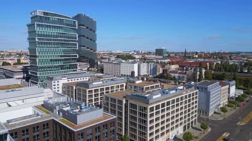 Berlin summer city Skyscraper office building. Magic aerial top view flight overflight flyover drone
