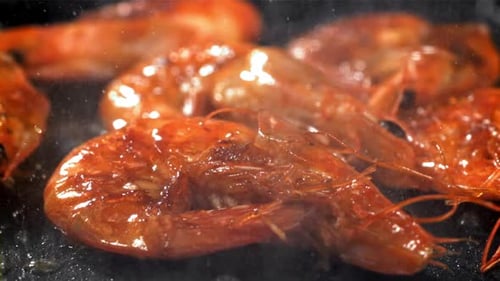 The Shrimp is Fried in a Pan with a Splash Filmed on a Highspeed Camera at 1000 Fps