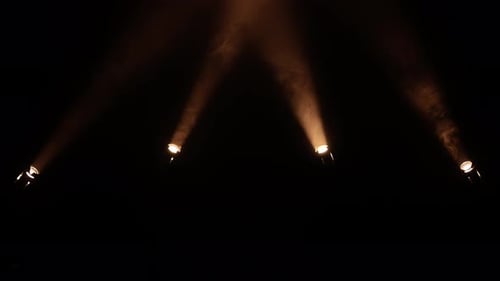 Dramatic Warm Spotlights with Haze on Black Background