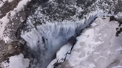 Iceland’s Dettifoss waterfall in winter | epic drone aerial of frozen nordic power