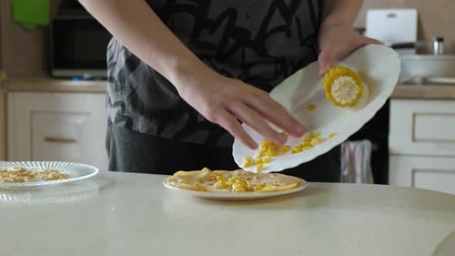 Corn Kernels Topped on Tortilla in Kitchen