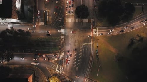 Aerial View of Nighttime Traffic Flow in a City Intersection