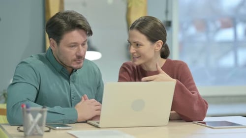 Creative People Working on Laptop in Office