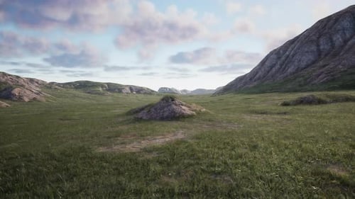 A Peaceful Meadow with a Majestic Mountain Backdrop