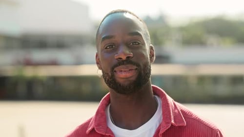Happy Young African Black Man Standing on Street Looking at Camera Portrait
