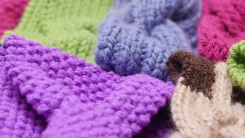 Knitted yarn pieces colorful panning close up