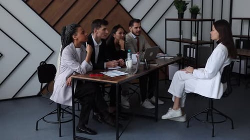 Group of Professionals Meeting in an Office