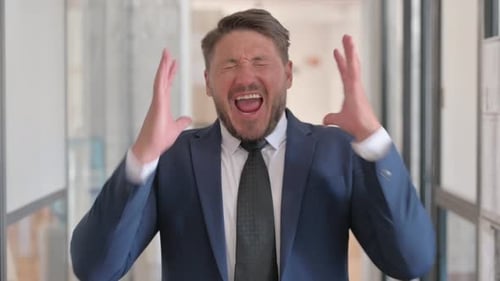 Man in Suit Screams in Frustration
