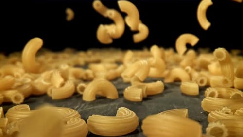 Dry Pasta Falls on the Table Filmed on a Highspeed Camera at 1000 Fps