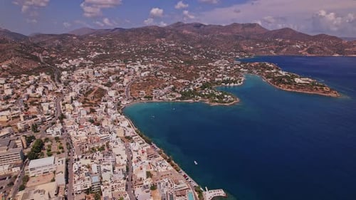 Aerial view of a coastal town in Greece during a sunny day