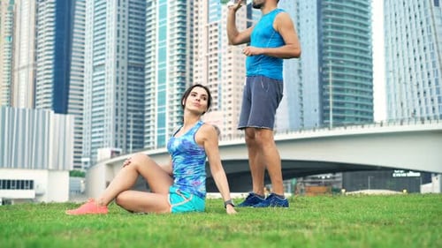 Couple Exercising in City Park