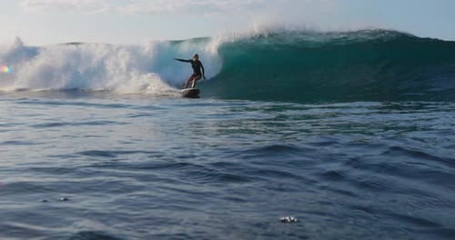 Woman Surfer Rides on the Ocean Wave Beautiful Surf Girl During Surfing