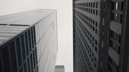 Low Angle Gliding Shot Moving Between Modern Buildings Skyscrapers in the New York City. Financial