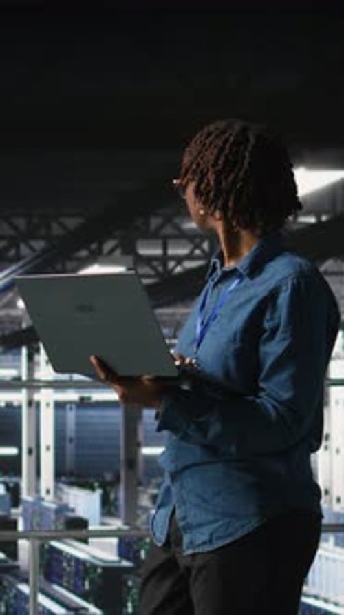 Vertical Video Data Center Software Developers Using Devices to Review AI LLM Visualizations