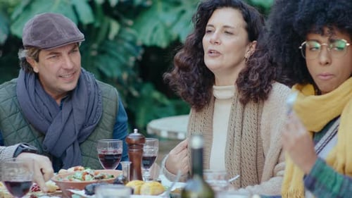 Friends Enjoying Outdoor Meal Together