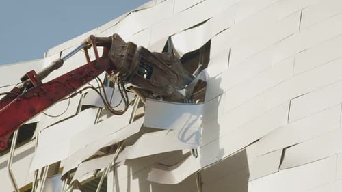 Excavator Destroys Facade of Dangerous Hockey Arena Closeup