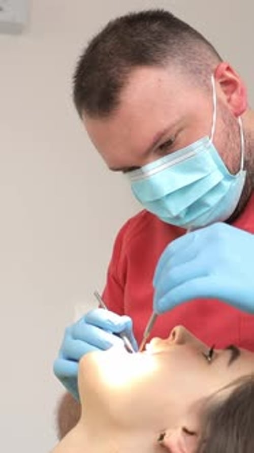 Beautiful Young Woman Having Dental Treatment in Dentist's Office Vertical Video