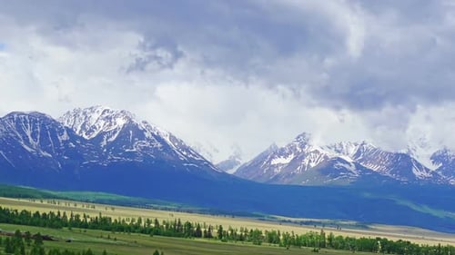 Snow Capped Mountains in a Rural Valley
