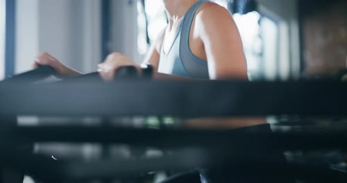 4k video footage of an attractive young sportswoman working out on an exercise bike in a gym