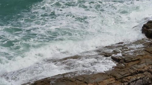 Big Waves Breaking on Shore with Sea Foam