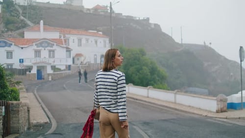 Pretty Girl Exploring City on Vacation Rear View