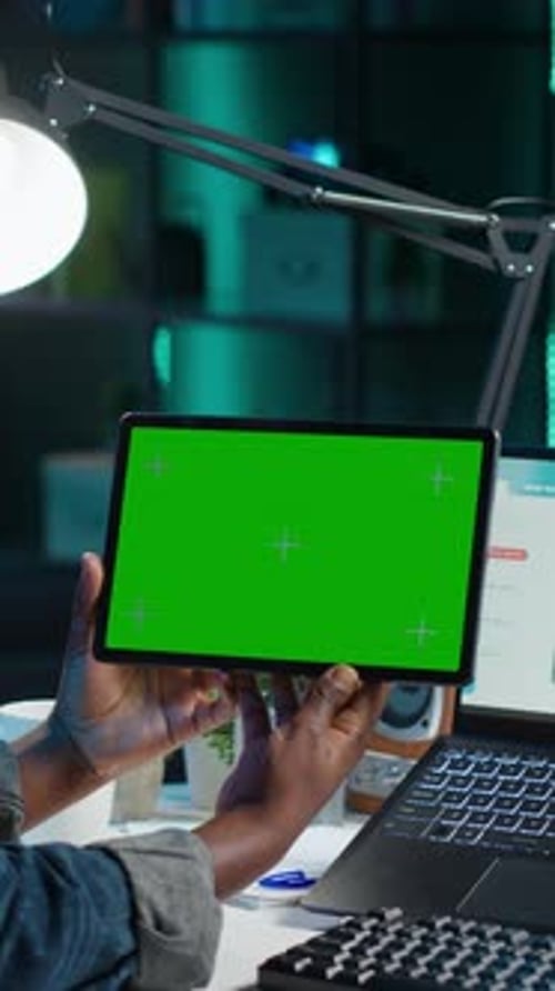 Vertical Video Broker Investor Wearing Headset Watching Videos on Isolated Screen Tablet