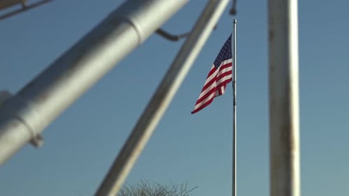 American Flag Waving Blue Sky Industrial Structure
