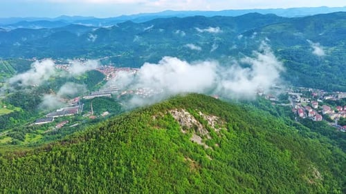 View From Rock to Town of Smolyan with Meadows for Cattle Walking and Houses Between Mountain Range