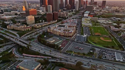 Aerial View of Los Angeles Freeway Interchange Busy LA Highway Traffic at Sunset Urban