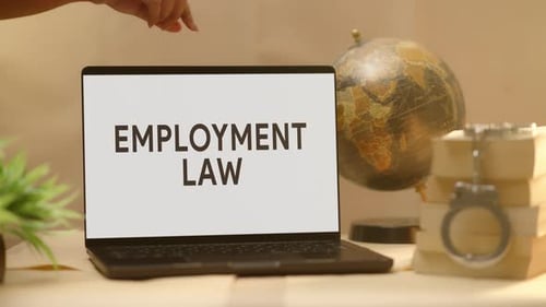 EMPLOYMENT LAW DISPLAYED IN LEGAL LAPTOP SCREEN