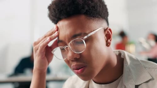 Office, businessman and stress with headache for deadline, anxiety and burnout at creative agency