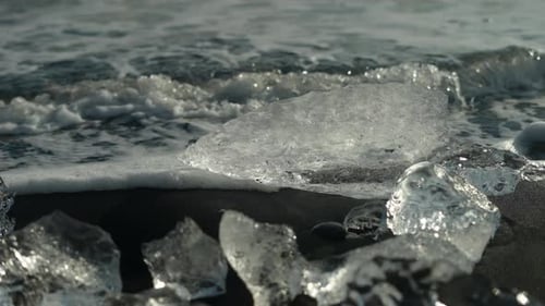Sea Wave Crashing On Ice On The Shore Of Diamond Beach