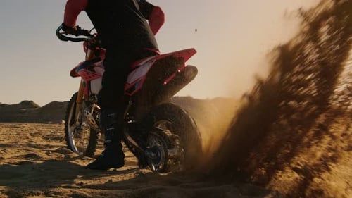 Back View Footage of the Professional Rider on the FMX Dirt Bike Twisting Full Throttle Handle and