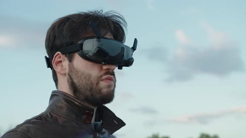 Young Man with Virtual Reality Goggles Pilot the Fpv Sport Drone