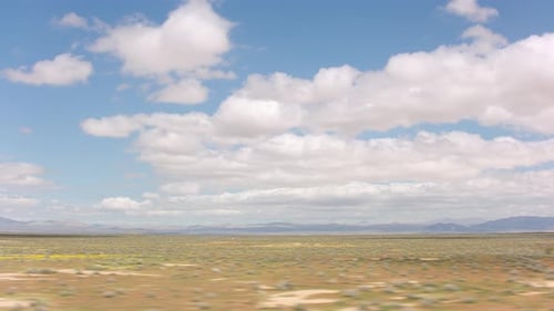 California Circa-2020. Stabilized Driving of Clouds Over Desert Landscape. With