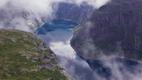 Beautiful nature Norway natural landscape Lovatnet lake flies above the clouds. fjords and mountains