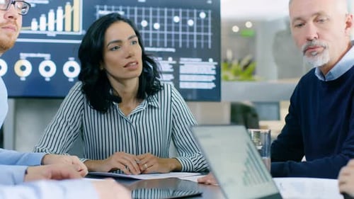 In the Meeting Room Diverse Group Business People Respond to the Statistical Growth Show on the Lap