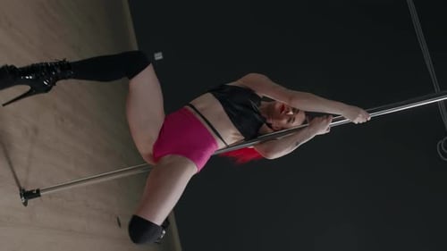 Sensual Woman Pole Dancing on Stripper Heels in Studio