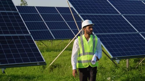 Indian Engineer Checking Solar Panels